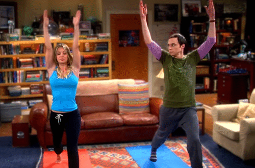 two people, one man and a woman in yoga poses